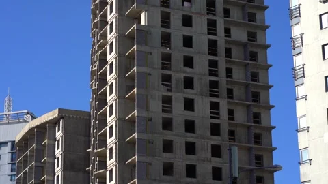 Multi-story building frame with concrete and brick walls close-up. Stock Footage 330536829