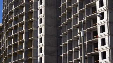 Multi-story building frame with concrete and brick walls close-up. Stock Footage 330536832