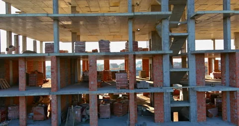 Multi-story building under construction in build progress concrete sections Stock Footage 165936632