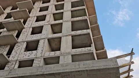 Multi Story Concrete Building Under Construction with Exposed Structure Vídeos de archivo 346019177