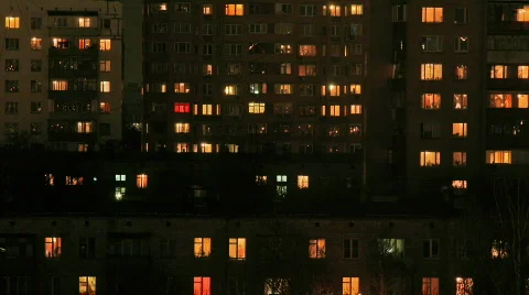 Multi-story housing at evening with windows lighting, HD Stock Footage 709899