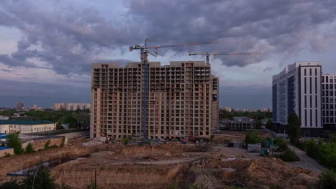 Multi story residential building under construction with cranes at sunset t.. Stock Footage 335644752