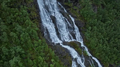 Multi-stream waterfall spreading across a steep rock face in Norway. Stock Footage 328132702