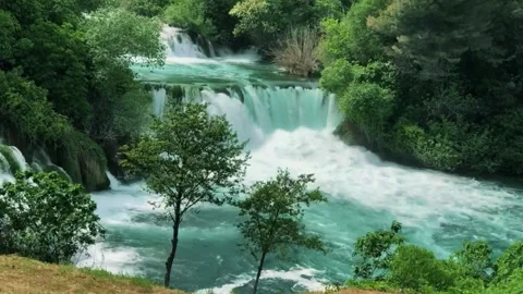 Multi tier waterfall, emerald water cascade, scenic nature falls Stock Footage 311048026