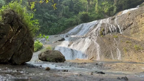 Multi-tiered Waterfall Cascading in Lush Tropical Forest, Static Shot Stock Footage 325303911