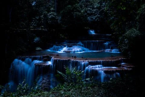 Multi Tiered Waterfall Flowing Softly In Dark Tropical Rainforest At Night .. 스톡 사진