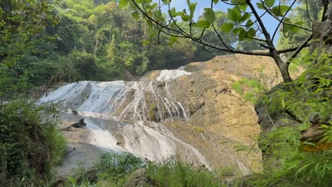 Multi-Tiered Waterfall Unveiling, Dense Tropical Rainforest, Panning Shot Stock Footage 325303551