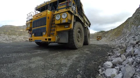 Multi-ton bulldozer on wheels in the background. 库存影片 55728214