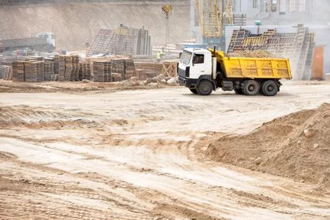 Multi-ton heavy mining dump truck loaded during removal of construction soil Stock Photos