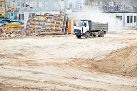 Multi-ton heavy mining dump truck loaded with cargo during removal of constru Stock Photos