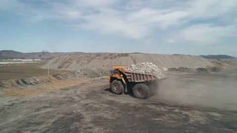 Multi-ton overweight dump truck brought waste rock for unloading. Element of Stock Footage 203918670