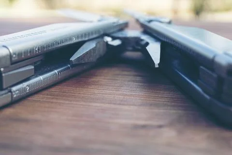 Multi tool on back red ground Stock Photos