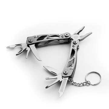 Multi tool with expanded tools and pliers isolated on a white background. Stock Photos