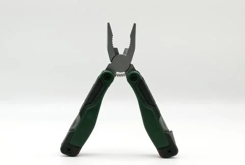 Multi tool with multiple functions and pliers on white background. Stock-Fotos