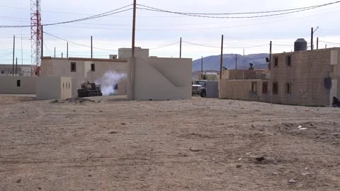 Multi-Utility Tactical Transport (MUTT) unmanned ground vehicle firing weapon Stock Footage 269329033