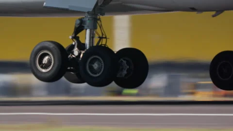 Multi wheel bogie of wide body jet at touchdown Stock Footage 337787817