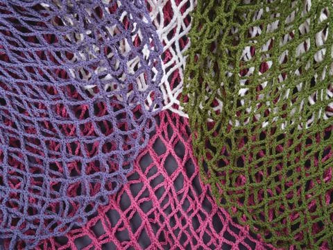 The multicolor background of the zero waste string bags, closeup of the knitt Stock Photos