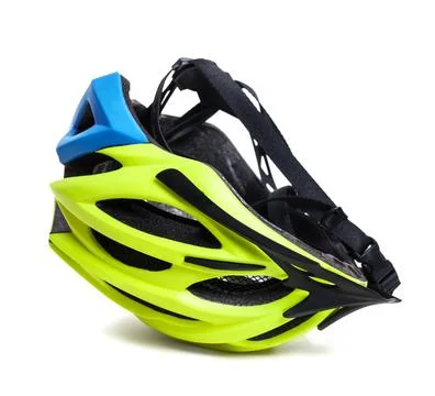 Multicolor bicycle helmet upside down on white Stock Photos