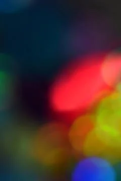 Multicolor bright large bokeh on a dark background. Macro. Copyspace. 스톡 사진
