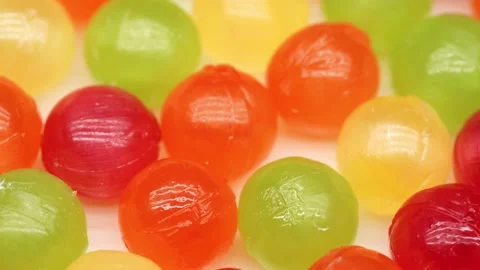 Multicolor Candy Falls on White Background Stock Footage 234997282