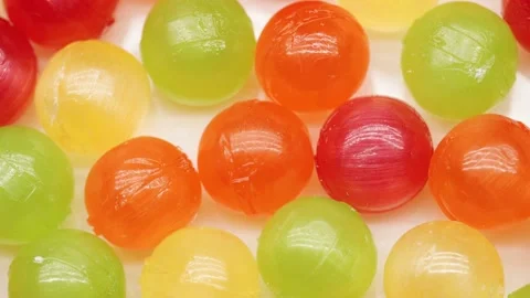 Multicolor Candy Falls on White Background Stock Footage 234997283