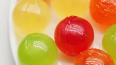 Multicolor Candy Falls on White Background Stock Footage 234997415
