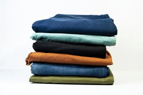 Multicolor casual pants stack for modern everyday fashion isolated on white Stock-Fotos