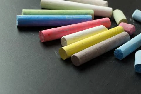 Multicolor chalk on chalkboard Stock Photos