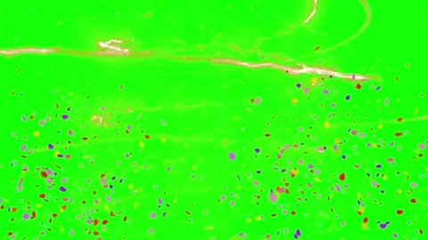 Multicolor Confetti Falling Against A Bright Green Screen Background For Visual Video stock 339124130