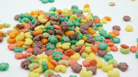 Multicolor corn puffs cereals rotating white background Stockbeeldmateriaal 201708795