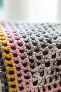 Multicolor crochet texture background with lace-like stitches Stock Photos