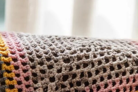 Multicolor crochet texture background with lace-like stitches Foto stock