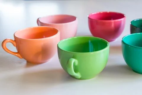 Multicolor cup's on a table Foto stock