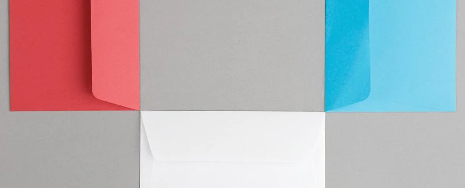 Multicolor envelopes on gray background Stock Photos