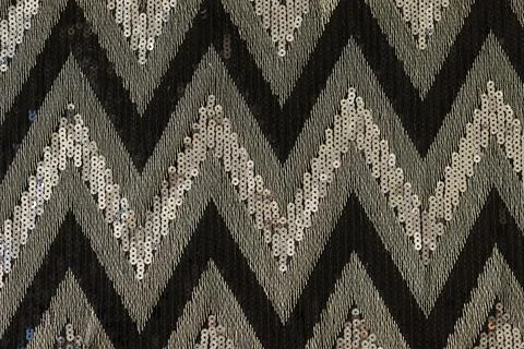 Multicolor fabric with zigzag pattern as background. Stock Photos