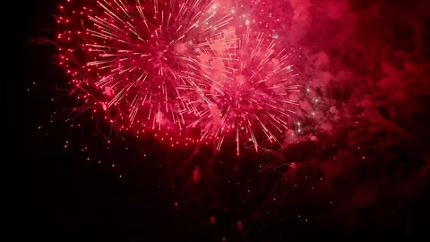 Multicolor fireworks explode across night sky with vibrant gold, green and blue Video stock 335371371