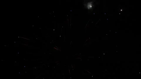 Multicolor fireworks sparks fly across black night sky on holiday event Stock Footage 253122111