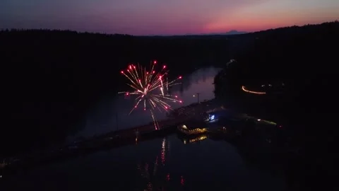 Multicolor Fireworks, Waterfront, and Olympic Mountains Captured at Sunset Stock Footage 246238145