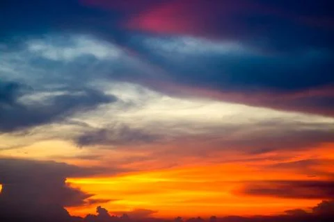 Multicolor  flame cloud sunset boat on sea and sky 写真素材
