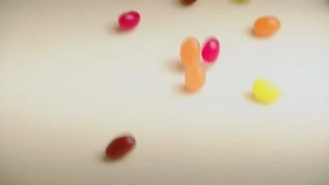Multicolor Jelly Beans Candy Falls on White Background. Bright Tasty Colourfu Stock Footage 152845665