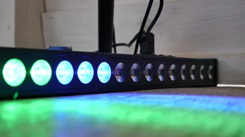 Multicolor LED wall washer light bar flashing on a stage Stock Footage 344070604