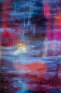 Multicolor light behind the ice. Stock Photos