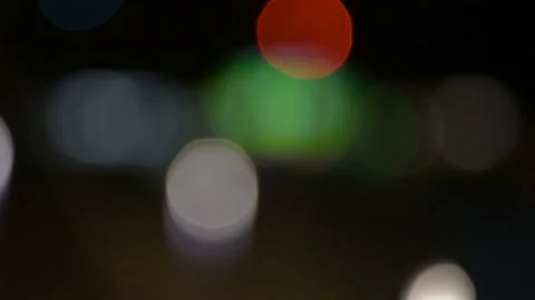 Multicolor moving defocused bokeh lights on a night background Stock Footage 217376319