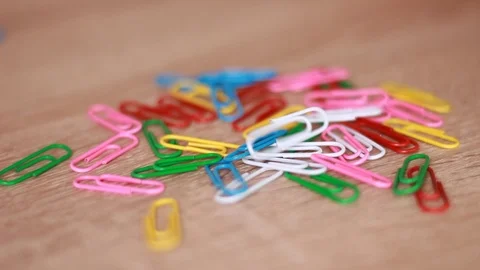 Multicolor paper clips on table Stock Footage 87545624