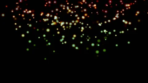 MULTICOLOR particles glowing on the black background. Black background with l Stock Footage 218579401
