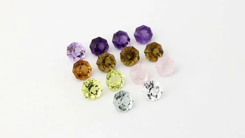 Multicolor quartz gemstone collection arranged on a white surface Stock Footage 348385647