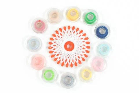 Multicolor sewing bobbin on white background Stock Photos