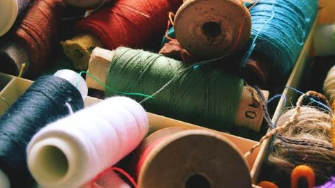Multicolor sewing threads background bobbins Stock Photos