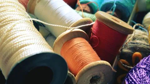 Multicolor sewing threads background bobbins spools Stock Photos
