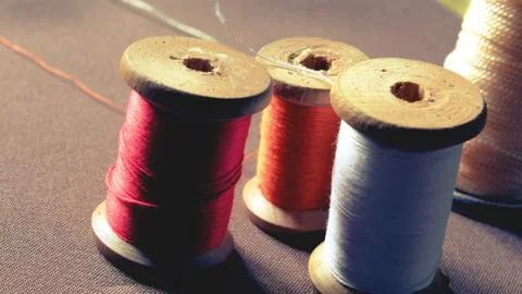 Multicolor sewing threads background bobbins spools vintage Stock Photos